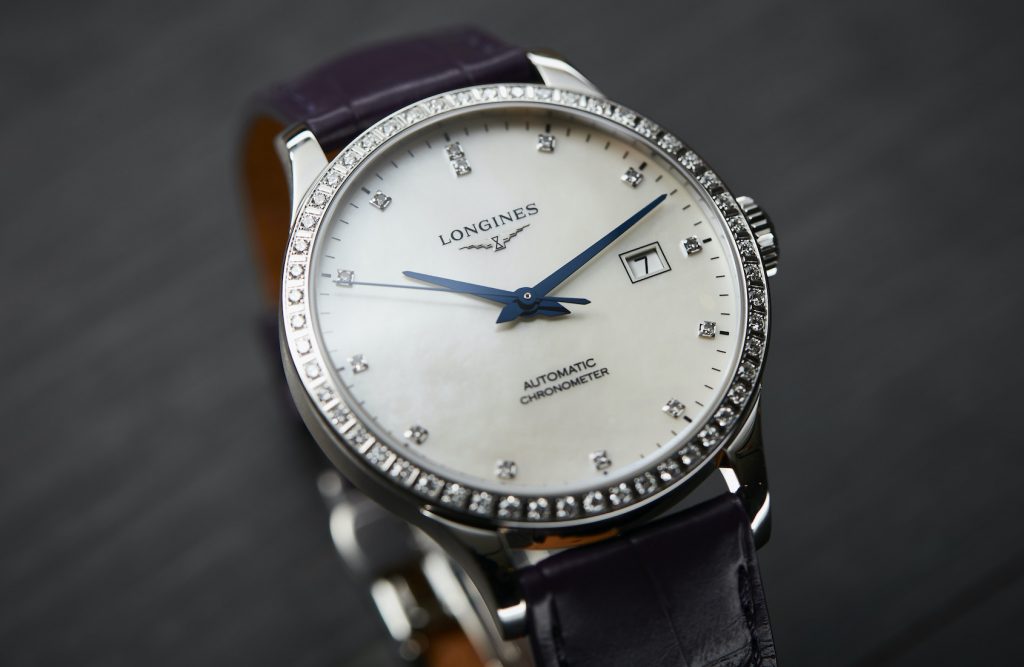 The stainless steel fake watch is decorated with diamonds.